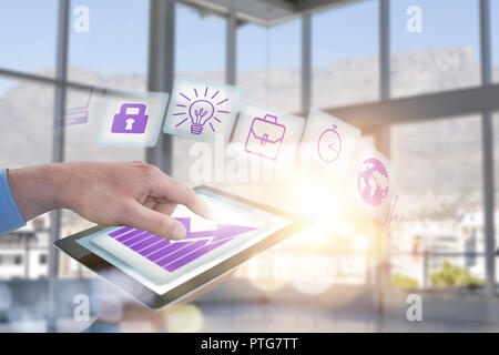 Composite image of croped hands of businessman using digital tablet Stock Photo