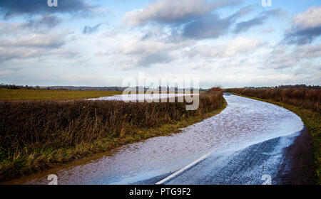 Country road blocked due to flood water Stock Photo