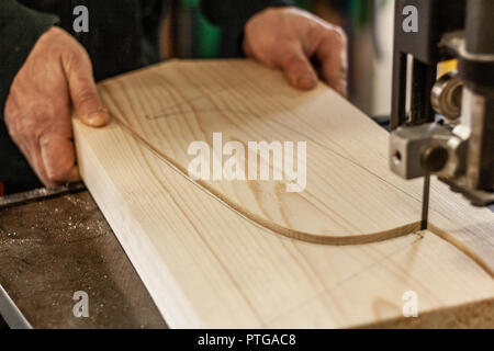 Eco-friendly woodworker's shop. Details and focus on the texture of the material, sawdust, and planers or chisels, while making legs for a nut desk. Stock Photo
