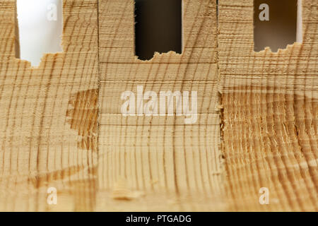 Eco-friendly woodworker's shop. Details and focus on the texture of the material, sawdust, and planers or chisels, while making legs for a nut desk. Stock Photo