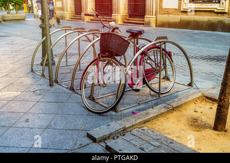 old bicycle parked on seville street old bicycle parked on seville street