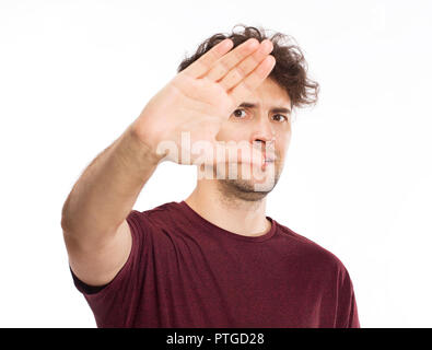 Young man covering his eyes by hands Stock Photo