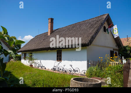 An old traditional Hungarian thatched roofed house in the small village of Ocsa near Budapest. Stock Photo