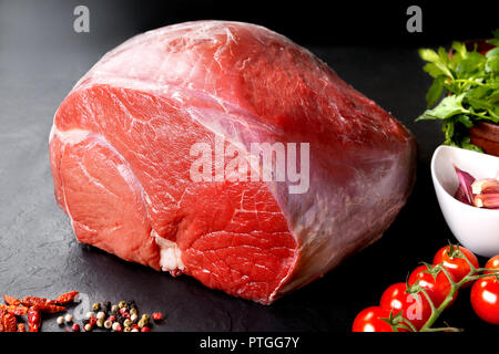 Raw meat. Uncooked fresh pork and beef. Red meat grilled barbecue grill in black stone background Stock Photo