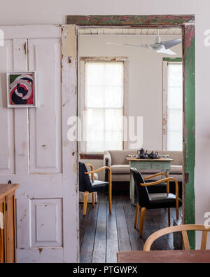 1950’s black leather Bentwood chairs on table with basalt Wedgwood Stock Photo