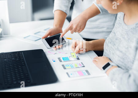 web designers creating mobile user interface Stock Photo