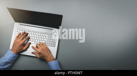 man typing on laptop computer. top view copy space Stock Photo
