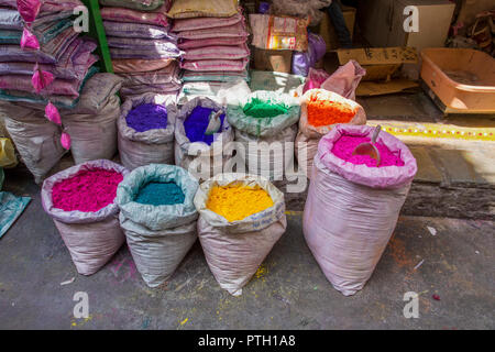 a stall selling paints and dyes at an Indian Market. Photographed in Ahmedabad, Gujarat, India Stock Photo