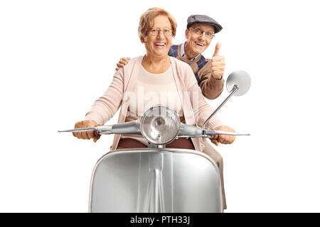 Seniors riding a retro scooter making a thumb up gesture isolated on white background Stock Photo