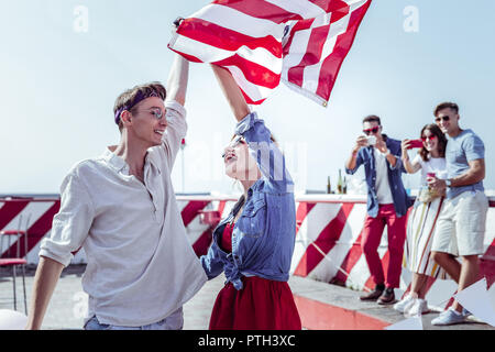 Joyful young people looking at each other Stock Photo