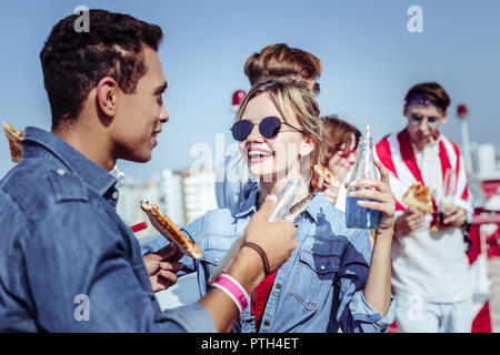 Positive delighted young people discussing their project Stock Photo