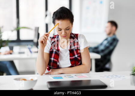 creative woman working on user interface at office Stock Photo