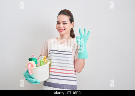 Cheerful Young Housewife Holding Bucket With Cleaning Supplies Stock Photo  - Download Image Now - iStock