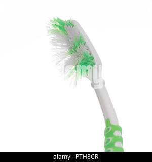 Old, worn out toothbrush isolated on white background. Dental, oral care. Stock Photo