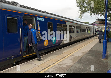 Northern rail train carriage and passengers people at the platform Windermere Railway Station Cumbria England UK United Kingdom GB Great Britain Stock Photo