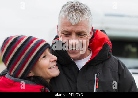Affectionate couple in warm clothing Stock Photo