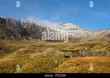 The summit of Mount Snowdon with Clogwyn Du ridge on the left and the remains of disused quarries in foreground Snowdonia National Park North Wales UK Stock Photo