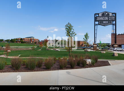 JOHNSON CITY, TN, USA-9/30/18: An open grassy park called 'King Commons',, featuring the large 'Johnson City' steel sign. Stock Photo