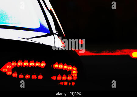 Car rear light in intersection signaling right turn. Photograph with filters. Stock Photo