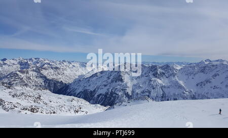 Image of ski resort in the winter with snow covered mountains and well prepared slops Stock Photo