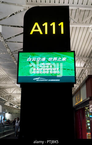 Boarding gate entrance number signboard in departure area.Guangzhou Baiyun International airport, China. Stock Photo