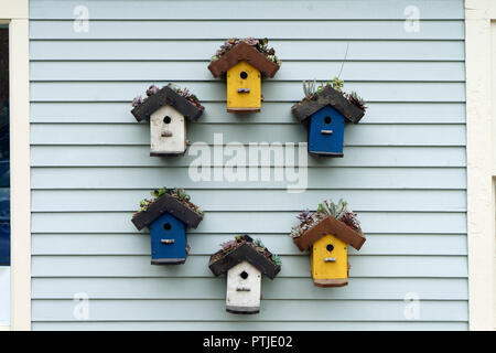 Hand-made wooden bird houses for sale at a German winter 