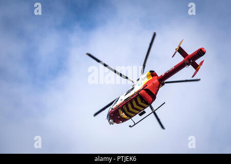 The Cornwall Air Ambulance helicopter McDonnell Douglas MD 902 Explorer flying overhead. Stock Photo