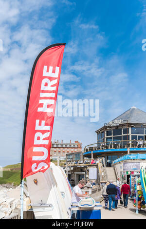 A colourful banner advertising surf hire at Fistral Beach in Newquay in Cornwall. Stock Photo