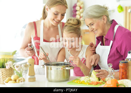 Portrait of mom and daughters cook to eat Stock Photo