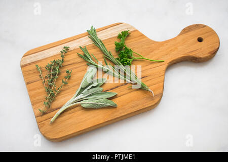 Fresh Herbs on a Cutting Board Stock Photo