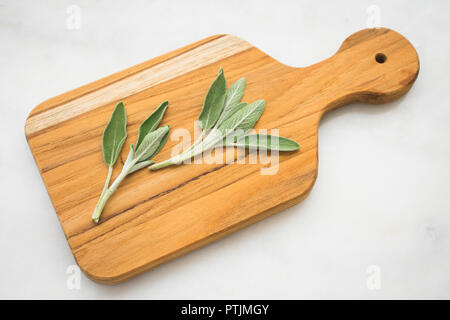 Sage Sprigs on a Cutting Board Stock Photo