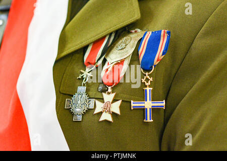 Military decorations on the uniform of the Polish army with the flag on the chest. Stock Photo