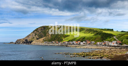 Panorama of single row of houses of Crovie coastal village on Gamrie Bay North Sea Aberdeenshire Scotland UK Stock Photo