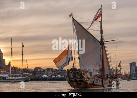 Kampen, The Netherlands - March 30, 2018: State Yacht De Utrecht in front of a sunset at Sail Kampen Stock Photo