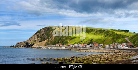 Panorama of single row of houses now holiday lets of Crovie coastal fishing village on Gamrie Bay North Sea Aberdeenshire Scotland UK Stock Photo