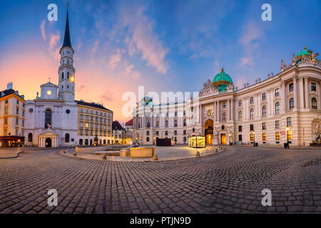 Vienna, Austria. Cityscape image of Vienna, Austria with St. Michael's Church and located at St. Michael Square during sunrise. Stock Photo