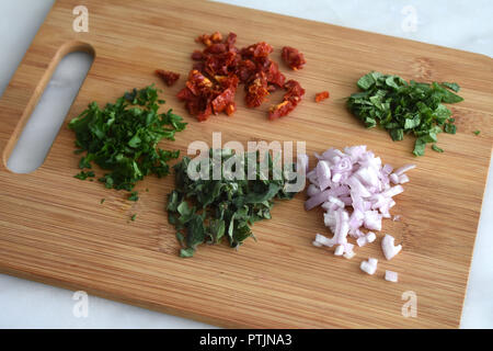 Chopped Herbs on a Cutting Board Stock Photo