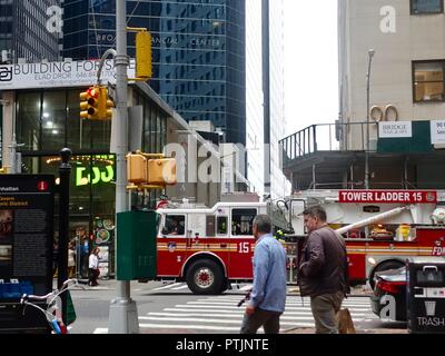 Fire truck crossing intersection Stock Photo - Alamy