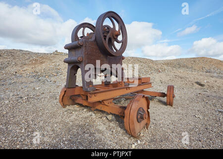Old abandoned stone crusher equipment remains of the once thriving mining industry on Melbeck Moor, Gunnerside, Swaledale, Yorkshires Dales, UK Stock Photo