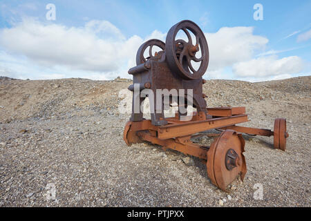 Old abandoned stone crusher equipment remains of the once thriving mining industry on Melbeck Moor, Gunnerside, Swaledale, Yorkshires Dales, UK Stock Photo