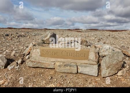 Stone sign marking the abandoned stone crusher equipment remains of the once thriving mining industry on Melbeck Moor Gunnerside, Yorkshires Dales, UK Stock Photo