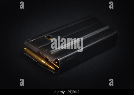 US ARMY M16 Rifle 20rd Magazine Vietnam war period with ammo on black background Stock Photo