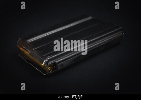 US ARMY M16 Rifle 20rd Magazine Vietnam war period with ammo on black background Stock Photo