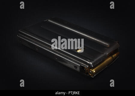 US ARMY M16 Rifle 20rd Magazine Vietnam war period with ammo on black background Stock Photo