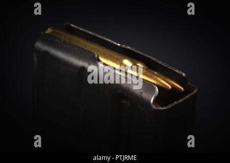 US ARMY M16 Rifle 20rd Magazine Vietnam war period with ammo on black background Stock Photo