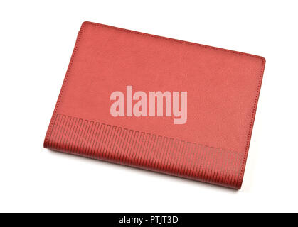 Red-brown notebook on white background. Stock Photo