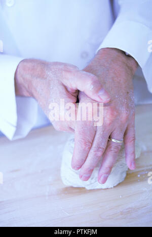 Repetitive motion hand injury to a bakery chef, USA Stock Photo