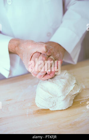 Repetitive motion hand injury to a bakery chef, USA Stock Photo