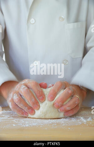 Pastry Chef Kneading dough, USA Stock Photo