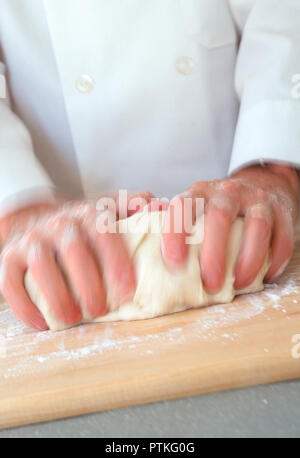 Pastry Chef Kneading Dough, USA Stock Photo